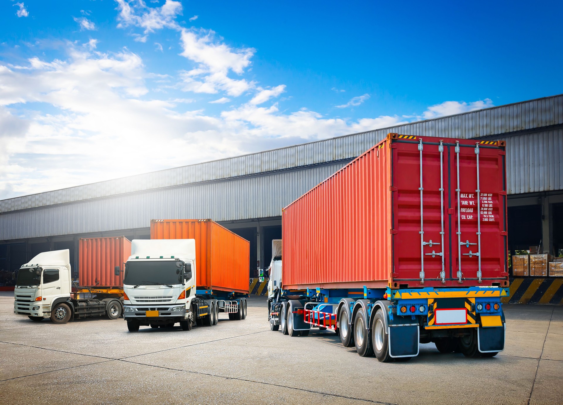 Semi Trailer Trucks on The Parking Lot. Trucks Loading at Dock Warehouse. Shipping Cargo Container Delivery Trucks. Distribution Warehouse. Freight Trucks Cargo Transport. Warehouse Logistic.